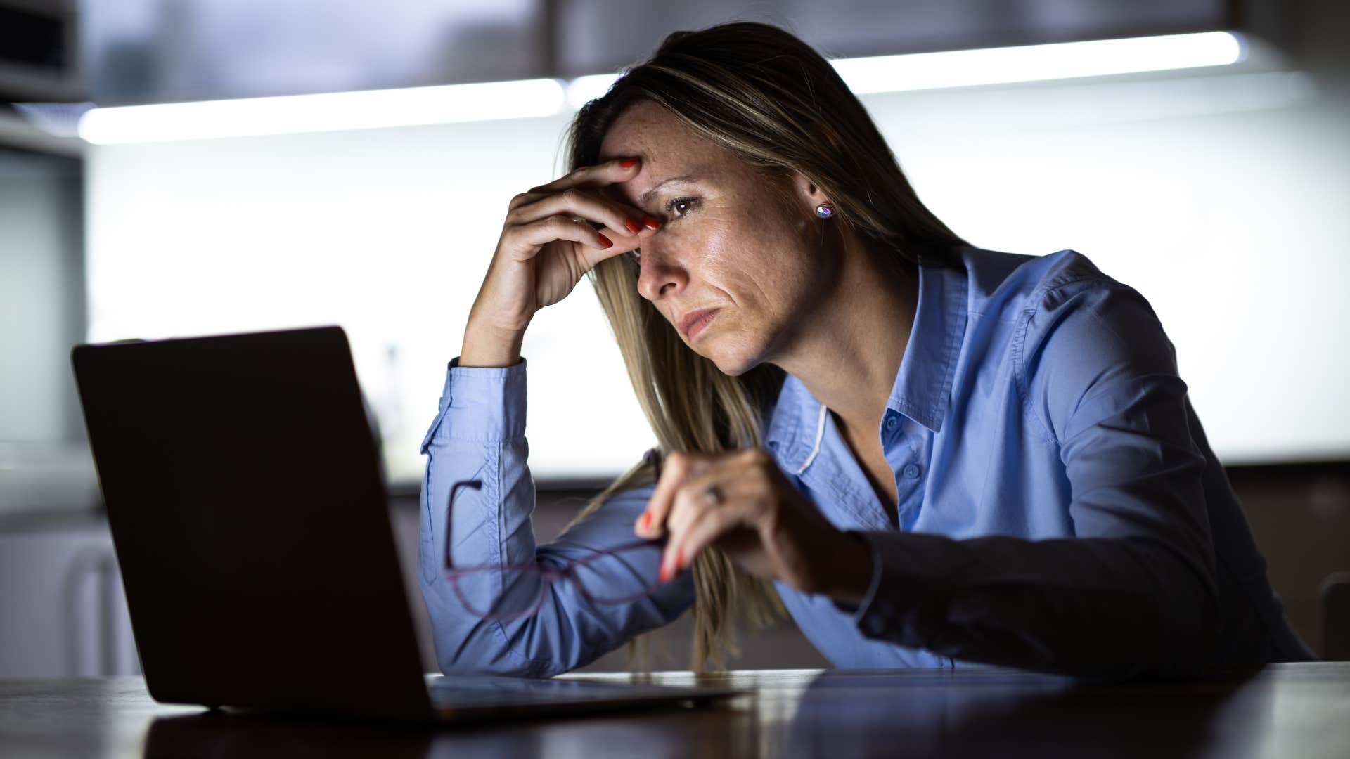 woman working late having no work-life balance