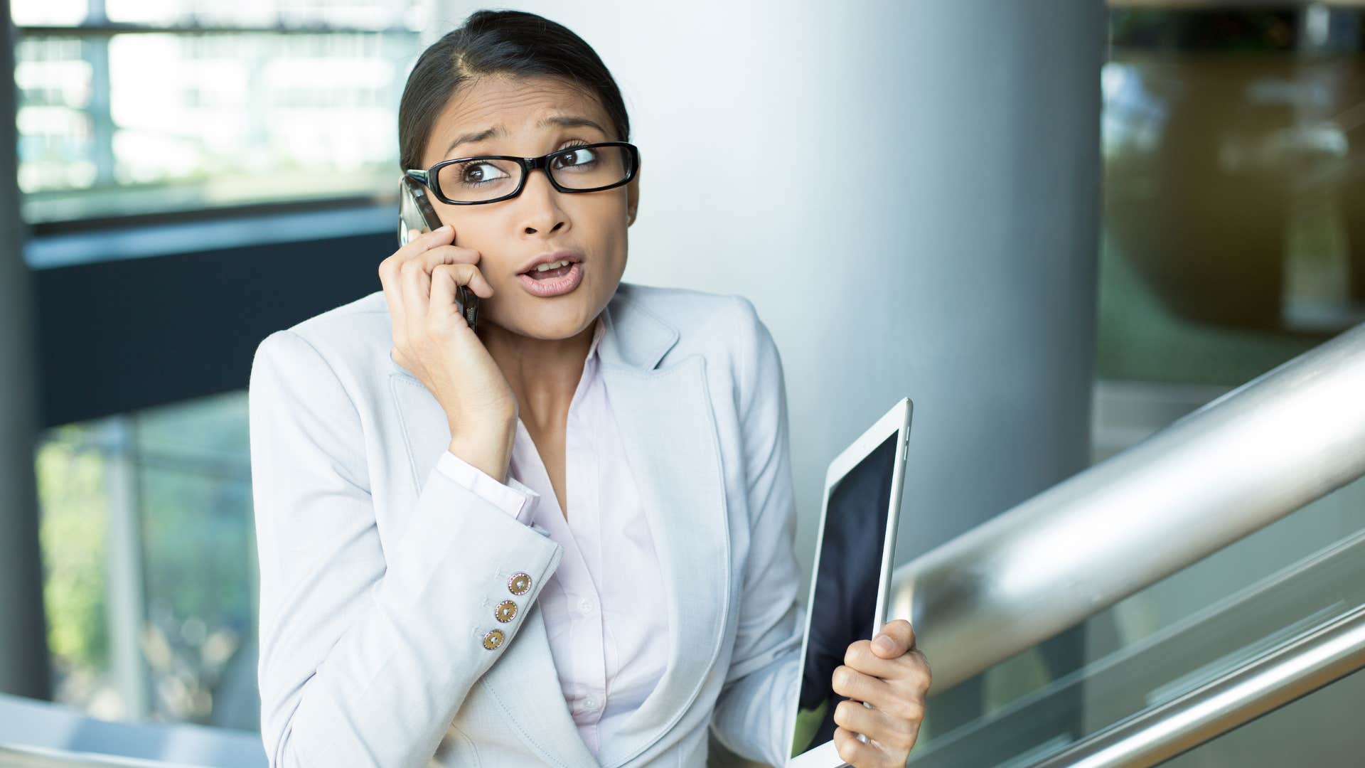 woman on phone overapologizing at work