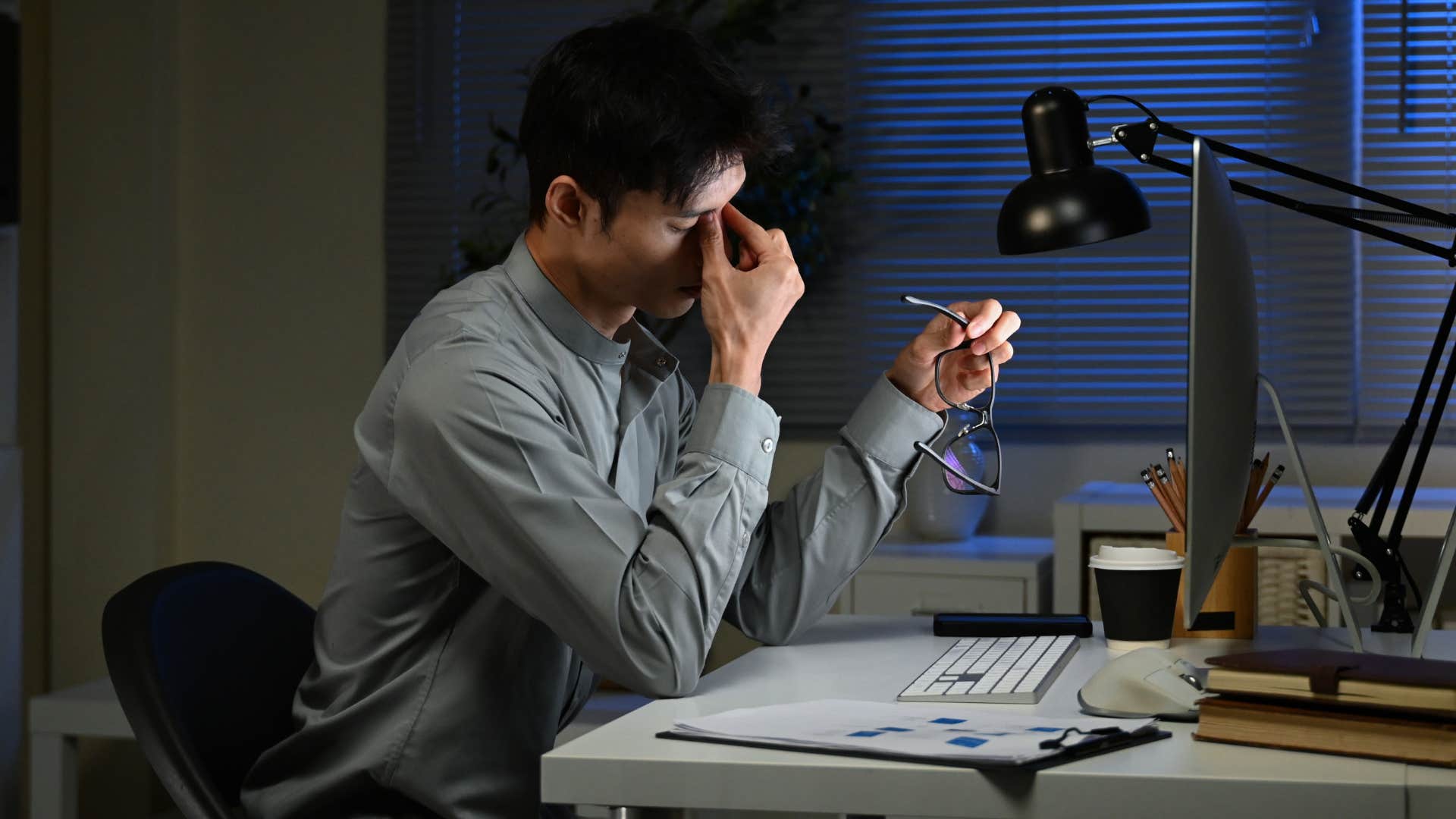 stressed man working late at the office