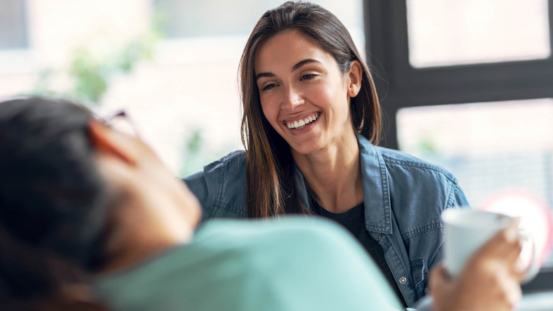 smart woman smiling and asking for help from her friend