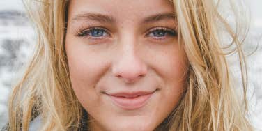 Woman is unbothered and happy.