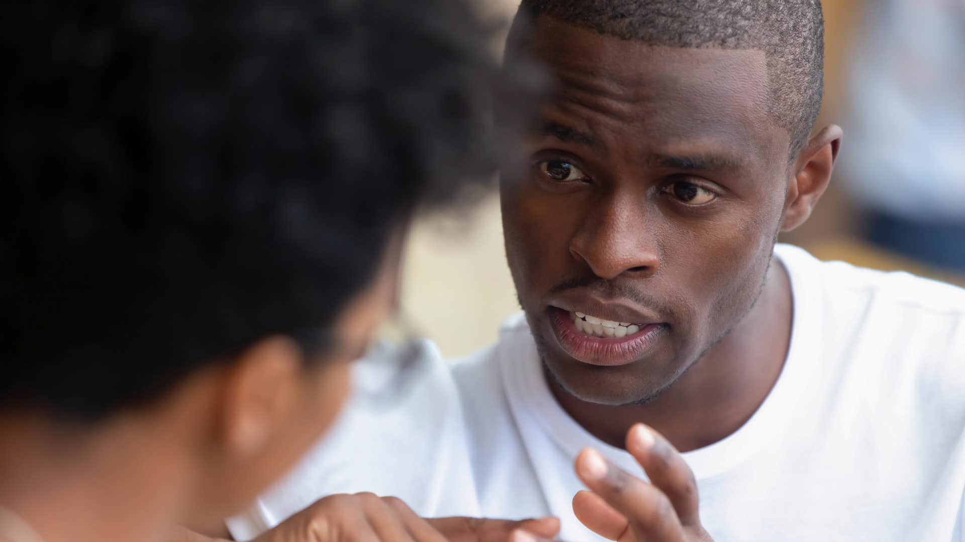 Man who minimizes other people's emotions in a conversation.