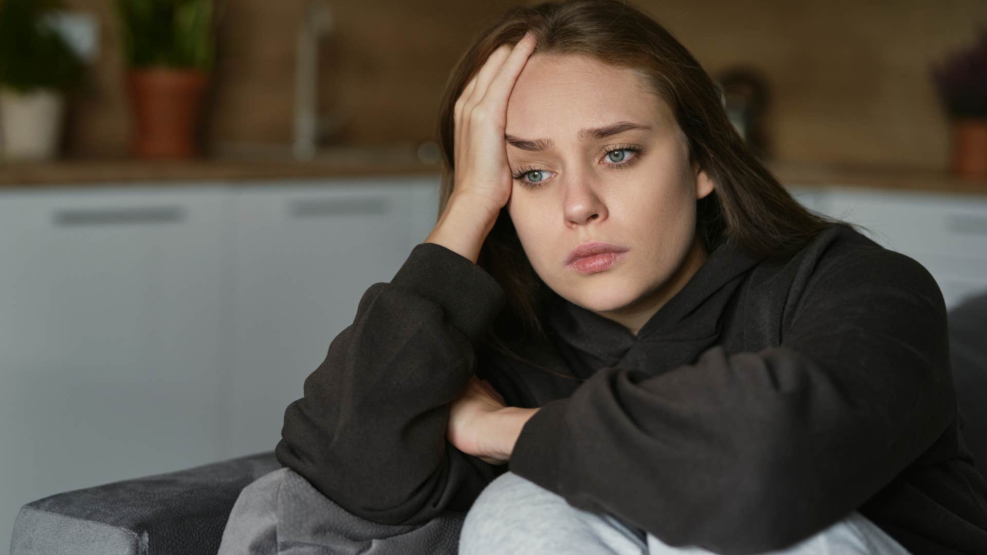 stressed woman who runs from conflict sitting alone