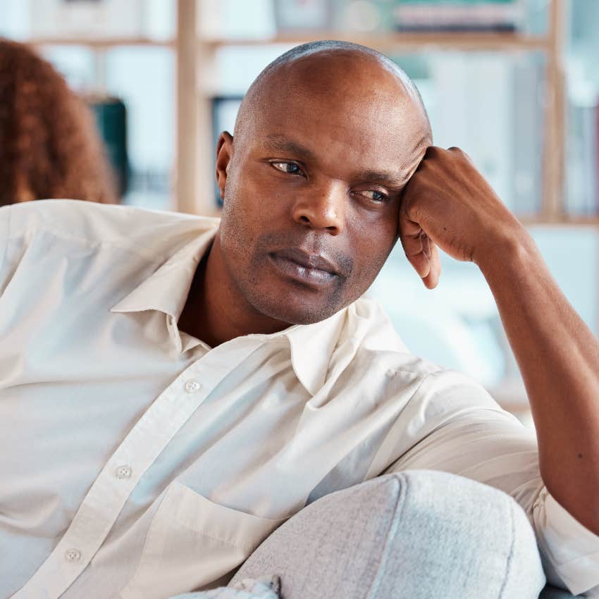 upset man in couple who's stopped resolving issues at home