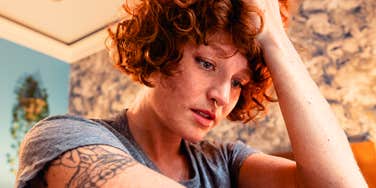 Woman feeling like she's drowning in shame over divorce. 