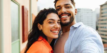 happy couple smiling woman appreciating her gentleman husband